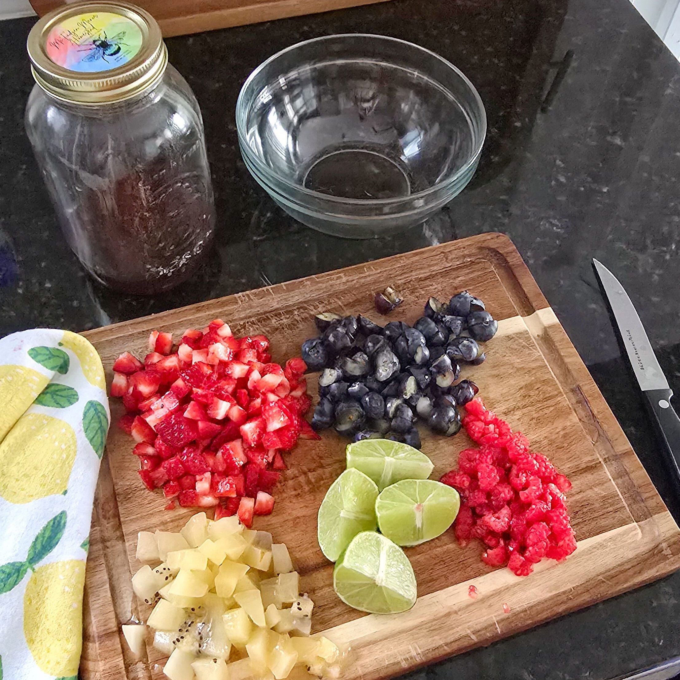 cut up fruit on a wooden cutting board